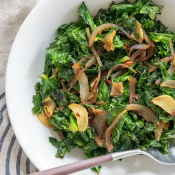 Sautéed Kale with Shallot, Ginger, Chili Crisp, and Lime recipe image