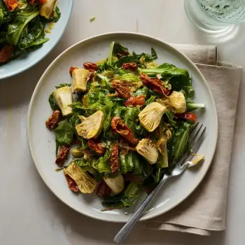 Sauteed Escarole with Garlic, Sun-dried Tomatoes, and Artichoke Hearts recipe image